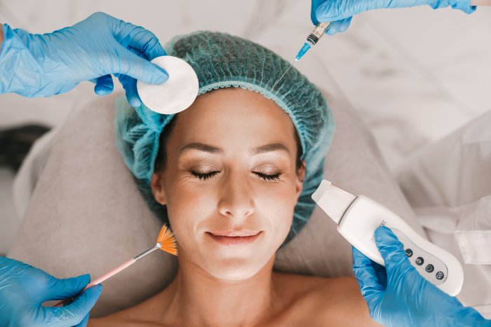 women undergoing an esthetic procdure with a needle, laser, brush and/or cotton pad